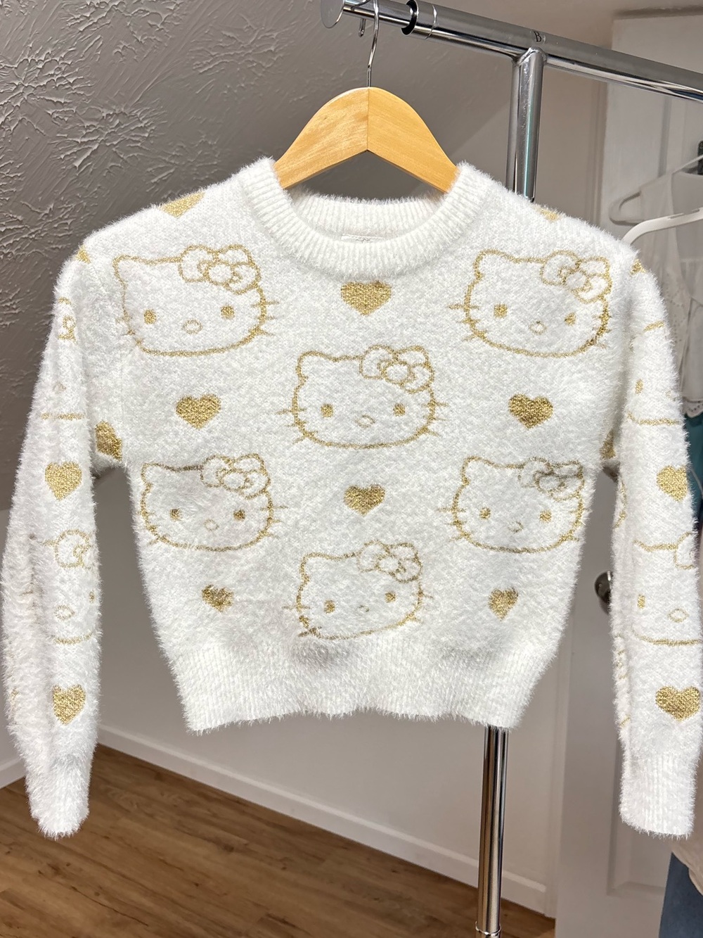 Hello Kitty fuzzy crewneck sweater w/ metallic pattern, Girl's size medium